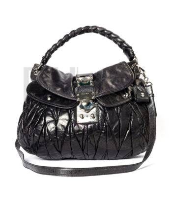 High-quality product photo of a Miu Miu Coffer Hobo Medium Embossed Navy Blue in Navy Blue